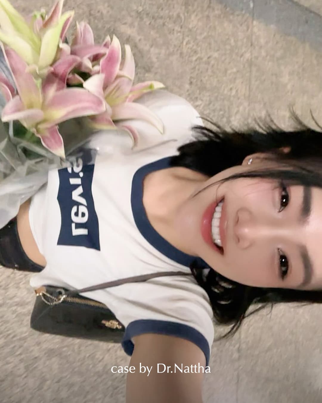 Khun Pim smiling with flowers