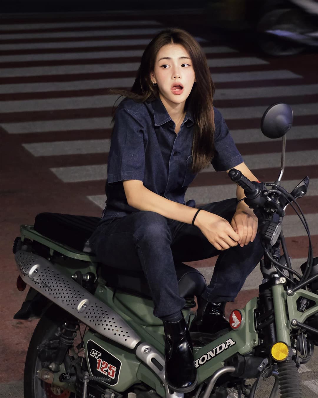 Khun Pim on a motorbike
